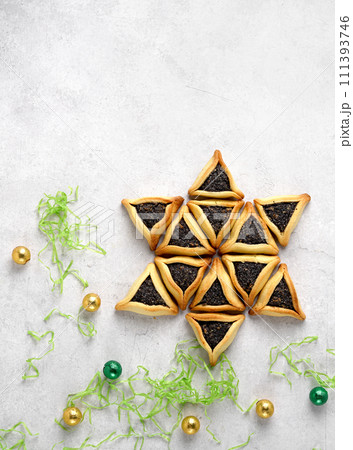 Traditional Jewish Hamantaschen cookies.Purim in the star form and candy balls Traditional Jewish Hamantaschen cookies.Purim in the star form and candy balls 111393746
