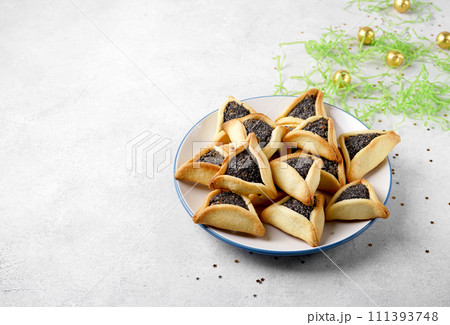 Traditional Jewish Hamantaschen cookies on the plate.Purim celebration concept. 111393748
