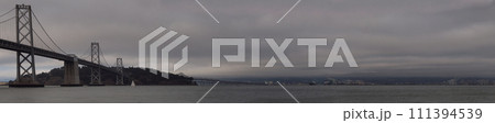 Panoramic of Boat sail by the San Francisco Bay Bridge on a foggy day Panoramic of Boat sail by the San Francisco Bay Bridge on a foggy day 111394539