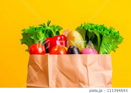 Craft brown shopping paper bag and grocery on blue background. Delivery concept 111394643