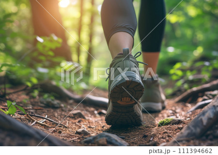 Close up of hiker feet walking outdoors in the forest. Generative AI 111394662