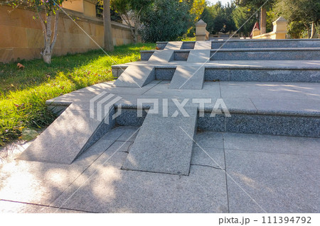 Missing handrails for safe descent or ascent do not allow wheelchair users to climb these stairs. The concept of accessibility for visiting urban public places for everyone 111394792