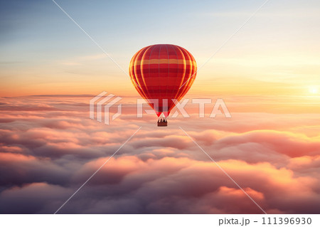 Colorful hot air balloon floats over a sea of clouds at sunset 111396930