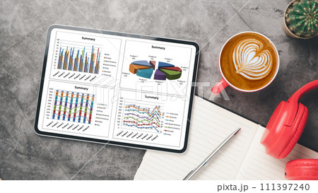 Office desk workplace with blank screen digital tablet, notebook, pen, headphone and cup of coffee, Top view flat lay. Office desk workplace with blank screen digital tablet, notebook, pen, headphone and cup of coffee, Top view flat lay. 111397240