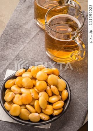 Tasty lupins and glass of beer Tasty lupins and glass of beer 111399028