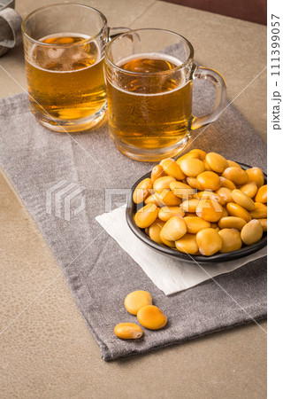 Tasty lupins and glass of beer Tasty lupins and glass of beer 111399057