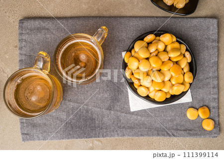 Tasty lupins and glass of beer Tasty lupins and glass of beer 111399114