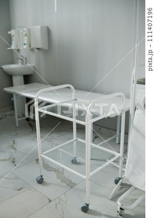 Empty push cart in medical office Empty push cart in medical office 111407196