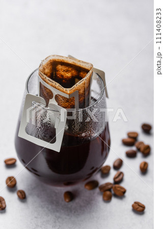 Drip Coffee Bag in a Glass Cup Drip Coffee Bag in a Glass Cup 111408233