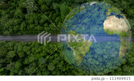 Aerial top view of green electric vehicle car driving over straight forest road, EV car electric vihicle car on forest road with globe green energy and eco power produced from sustainable. Aerial top view of green electric vehicle car driving over straight forest road, EV car electric vihicle car on forest road with globe green energy and eco power produced from sustainable. 111409915