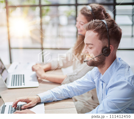 Customer Service Representative With Colleague Working In Office Customer Service Representative With Colleague Working In Office 111412450