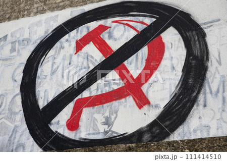 Russian symbol hammer and sickle graffiti crossed out. Sanctions to Russia. Stop the war in Ukraine 111414510