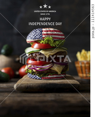 American Burger with tomatoes, onions, cucumber, lettuce and melting cheese. United States of America flag. Happy independence day. 4th of July celebration American Burger with tomatoes, onions, cucumber, lettuce and melting cheese. United States of America flag. Happy independence day. 4th of July celebration 111414563