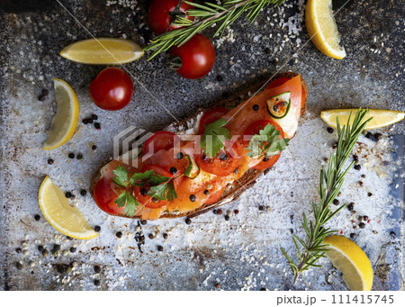 Salted salmon open sandwich with tomatoes, cream cheese, cucumber, parsley and pepper. Healthy seafood Salted salmon open sandwich with tomatoes, cream cheese, cucumber, parsley and pepper. Healthy seafood 111415745