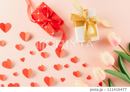 Top view flat lay of paper hearts, flower and gift box on pastel pink background surprise your loved with space for text, birthday greeting, web design banner holiday, Happy Valentine Day Background Top view flat lay of paper hearts, flower and gift box on pastel pink background surprise your loved with space for text, birthday greeting, web design banner holiday, Happy Valentine Day Background 111416477