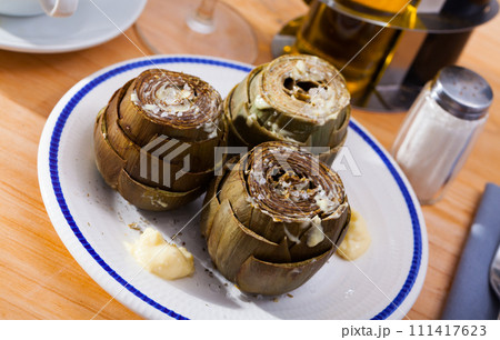 Plate of tasty steamed artichoke Plate of tasty steamed artichoke 111417623