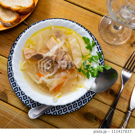 Soup of cabbage shchi with vegetables and pork. Russian cuisine 111417837