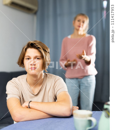 Portrait of unhappy son after discord with mother 111417953