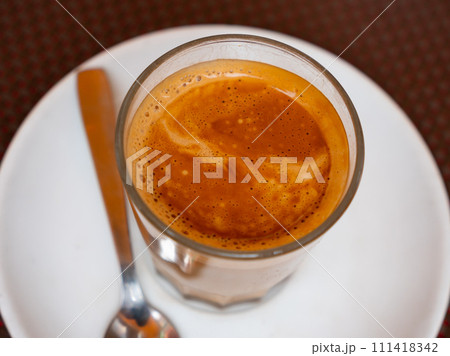 Coffee cortado and on the wooden table 111418342