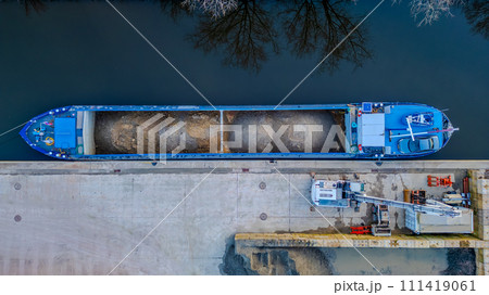 Top-Down View of Cargo Ship Loading at Dock Top-Down View of Cargo Ship Loading at Dock 111419061