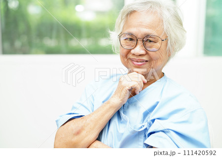 Asian senior woman wearing eyeglasses or vision glasses at home care service. Asian senior woman wearing eyeglasses or vision glasses at home care service. 111420592