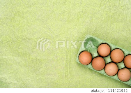 Green carton of different eggs. Easter background Green carton of different eggs. Easter background 111421932