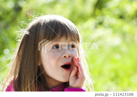 Close-up portrait of a little pretty girl with shouting face expression 111423106