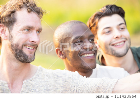 Friends Sharing a Joyful Moment Outdoors 111423864