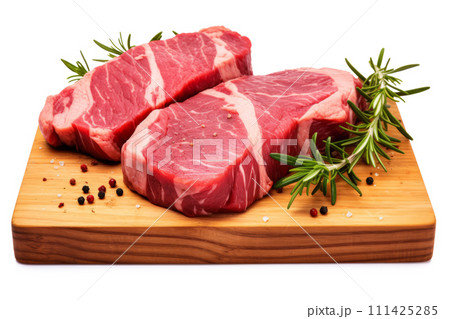 Fresh raw meat steaks on cutting board isolated on white background Fresh raw meat steaks on cutting board isolated on white background 111425285