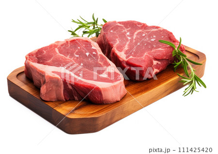 Fresh raw meat steaks on cutting board isolated on white background Fresh raw meat steaks on cutting board isolated on white background 111425420
