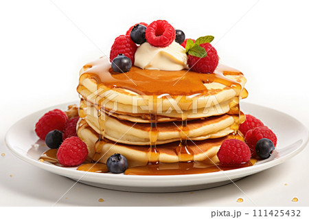 Pancakes served with syrup and fruits on white plate 111425432
