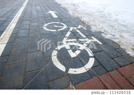 Bicycle path sign on the snow closeup Bicycle path sign on the snow closeup 111426538