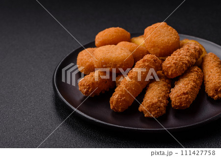 Delicious nuggets, rings and balls of mozzarella and parmesan cheese with salt and spices 111427758