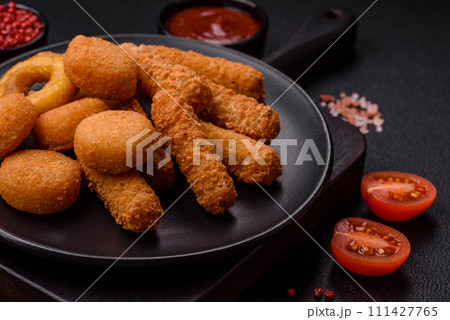 Delicious nuggets, rings and balls of mozzarella and parmesan cheese with salt and spices 111427765
