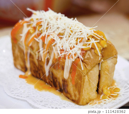 Fresh grilled delicious sandwich with topping and filling plated in white plate, just freshly baked Fresh grilled delicious sandwich with topping and filling plated in white plate, just freshly baked 111428362