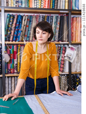 Female owner of fabric store Female owner of fabric store 111428688