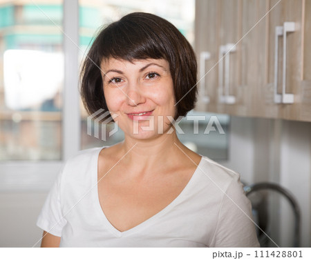 Portrait of positive housewife Portrait of positive housewife 111428801