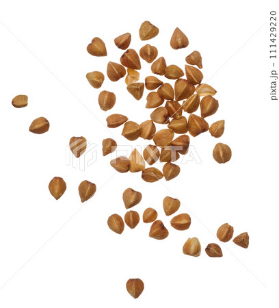 Raw buckwheat grains on isolated background 111429220