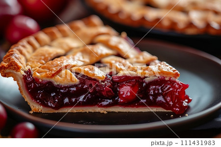 Plate with homemade cherry pie on wooden table, close-up Plate with homemade cherry pie on wooden table, close-up 111431983