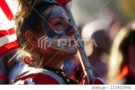 Fan wearing a jersey, face paint, and holding a team flag Fan wearing a jersey, face paint, and holding a team flag 111432042