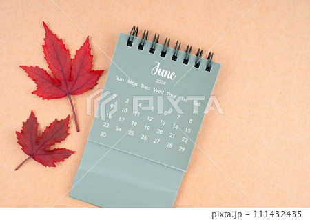 June 2024 monthly calendar and fall leaves. 111432435