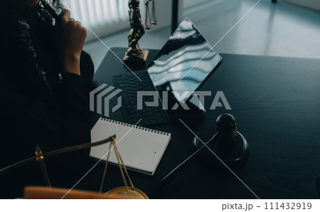 Judge gavel with Justice lawyers having team meeting at law firm background. Concepts of Law and Legal services. Judge gavel with Justice lawyers having team meeting at law firm background. Concepts of Law and Legal services. 111432919