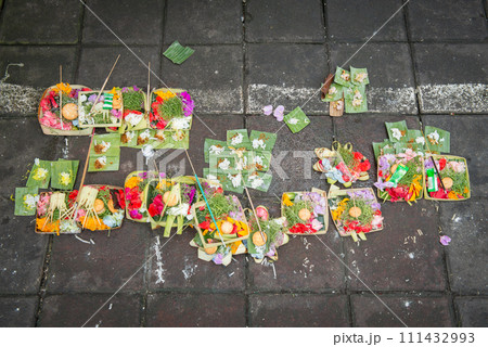 Group of sacrifice oblation offerings for Gods and spiritual in Hinduism on the street of Ubud market in Bali, Indonesia. Group of sacrifice oblation offerings for Gods and spiritual in Hinduism on the street of Ubud market in Bali, Indonesia. 111432993