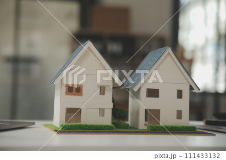 Business Signing a Contract Buy - sell house, insurance agent analyzing about home investment loan Real Estate concept. 111433132