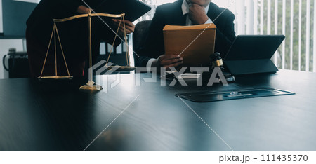 Judge gavel with Justice lawyers having team meeting at law firm background. Concepts of Law and Legal services. Judge gavel with Justice lawyers having team meeting at law firm background. Concepts of Law and Legal services. 111435370