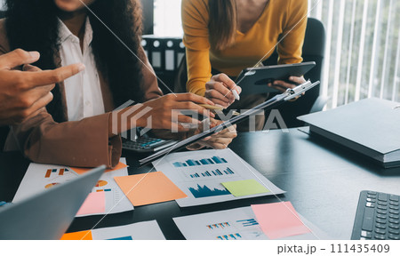 Business team collaboration discussing working analyzing with financial data and marketing growth report graph in team, presentation and brainstorming to strategy planning making profit of company. 111435409