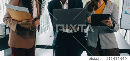 Co working conference, Business team meeting present, investor colleagues discussing new plan financial graph data on office table with laptop and digital tablet, Finance, accounting, investment. 111435449