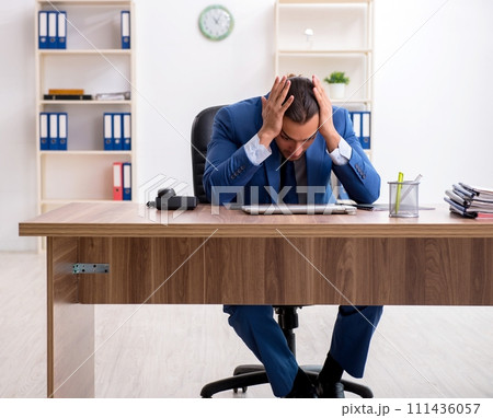 Young male businessman employee working in the office 111436057