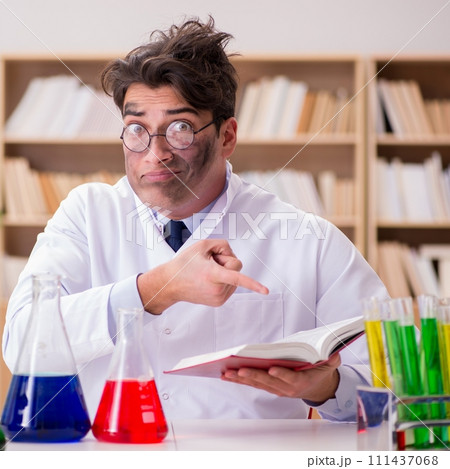 Mad crazy scientist doctor doing experiments in a laboratory 111437068