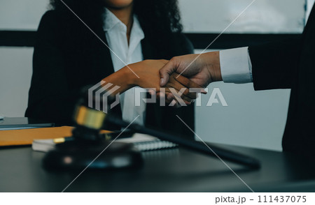 Judge gavel with Justice lawyers having team meeting at law firm background. Concepts of Law and Legal services. Judge gavel with Justice lawyers having team meeting at law firm background. Concepts of Law and Legal services. 111437075